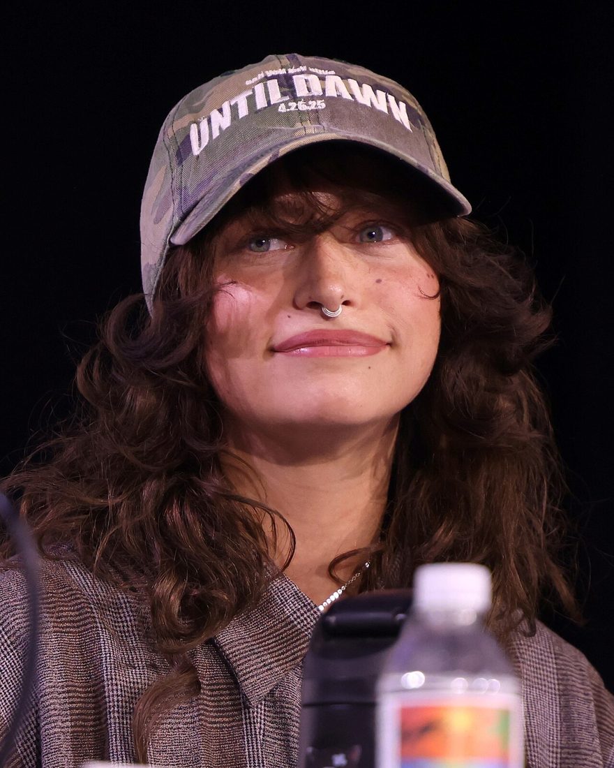 Odessa A'zion speaking on a convention panel